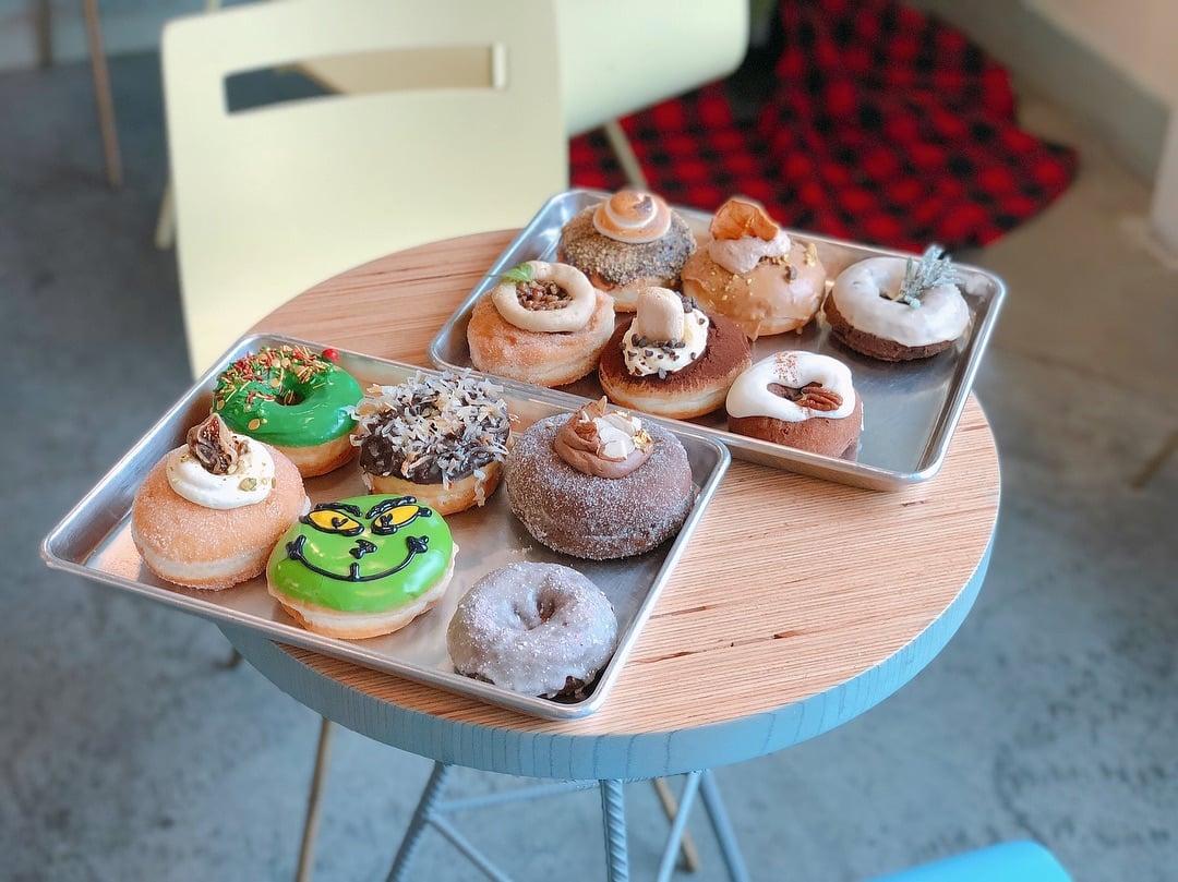 Cupcakes with assorted colors of icing and toppings.