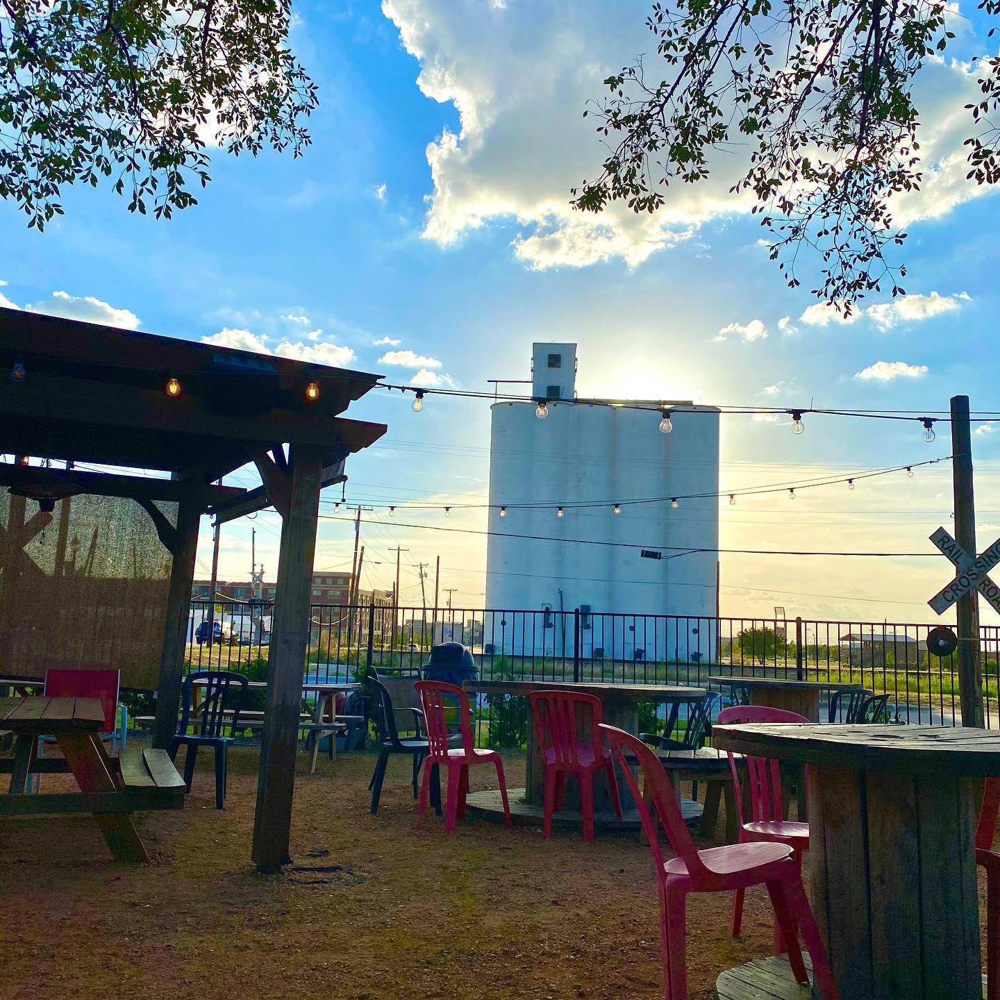 outdoor dining area with red chairs