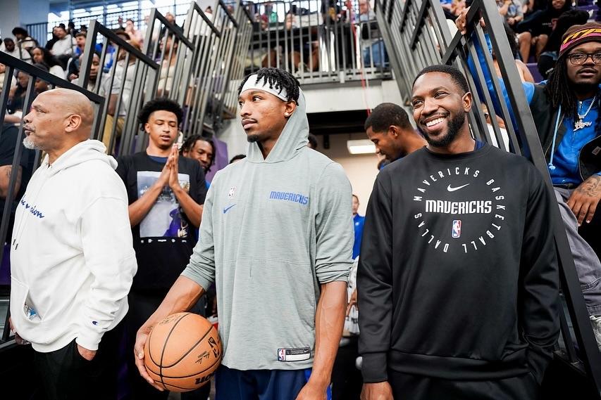 Basketball players entering the court
