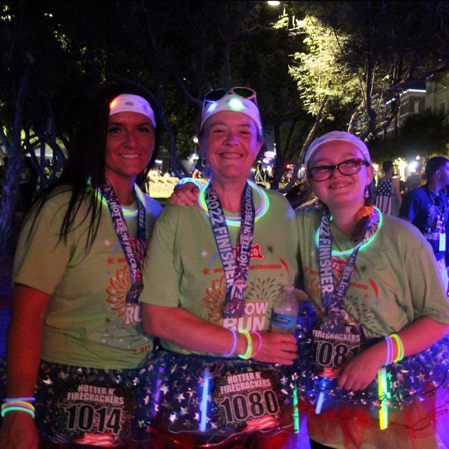 women posing after running a marathon