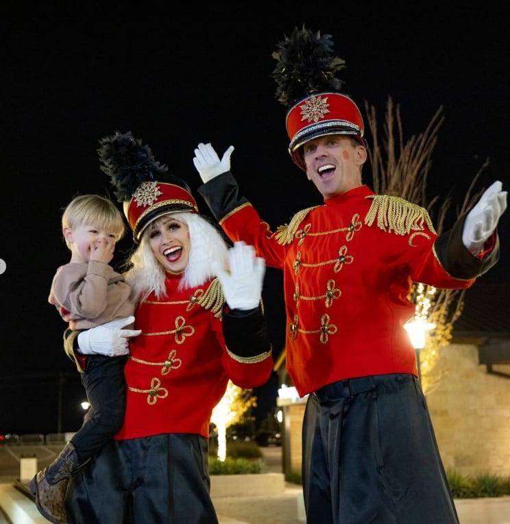 a family posing while dressed up as toy soilders