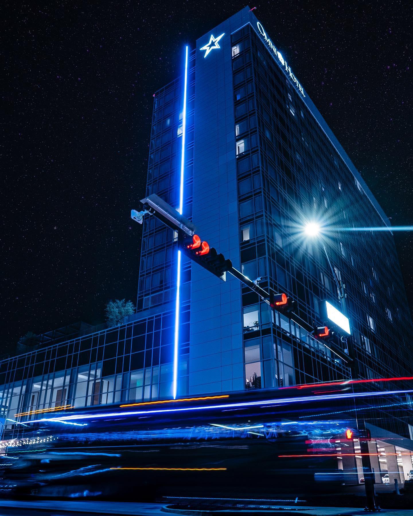 stop light in front of a hotel
