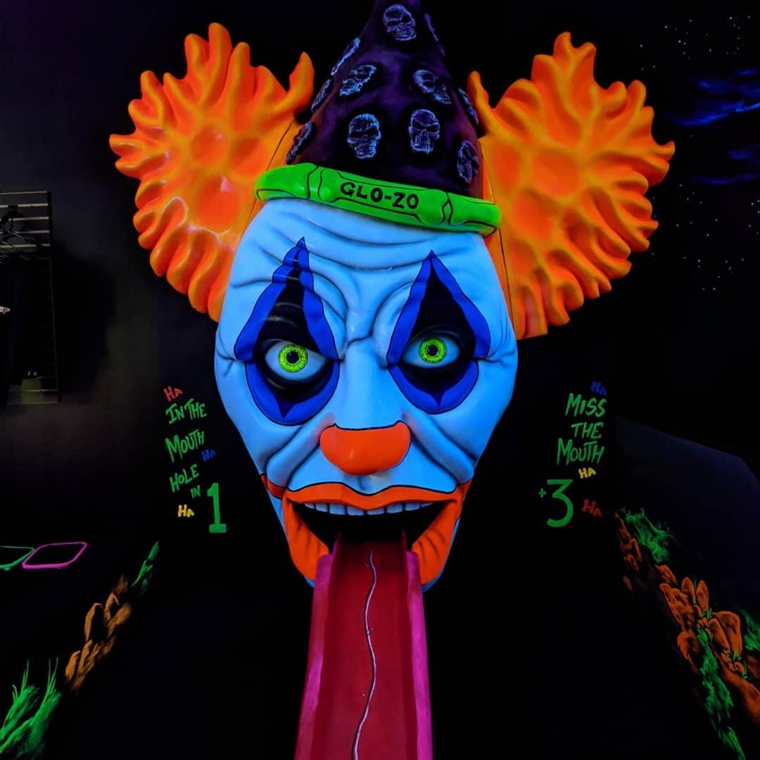 a spooky glow in the dark clown face