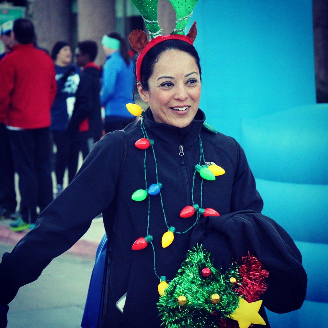 a woman in festive attire smiling