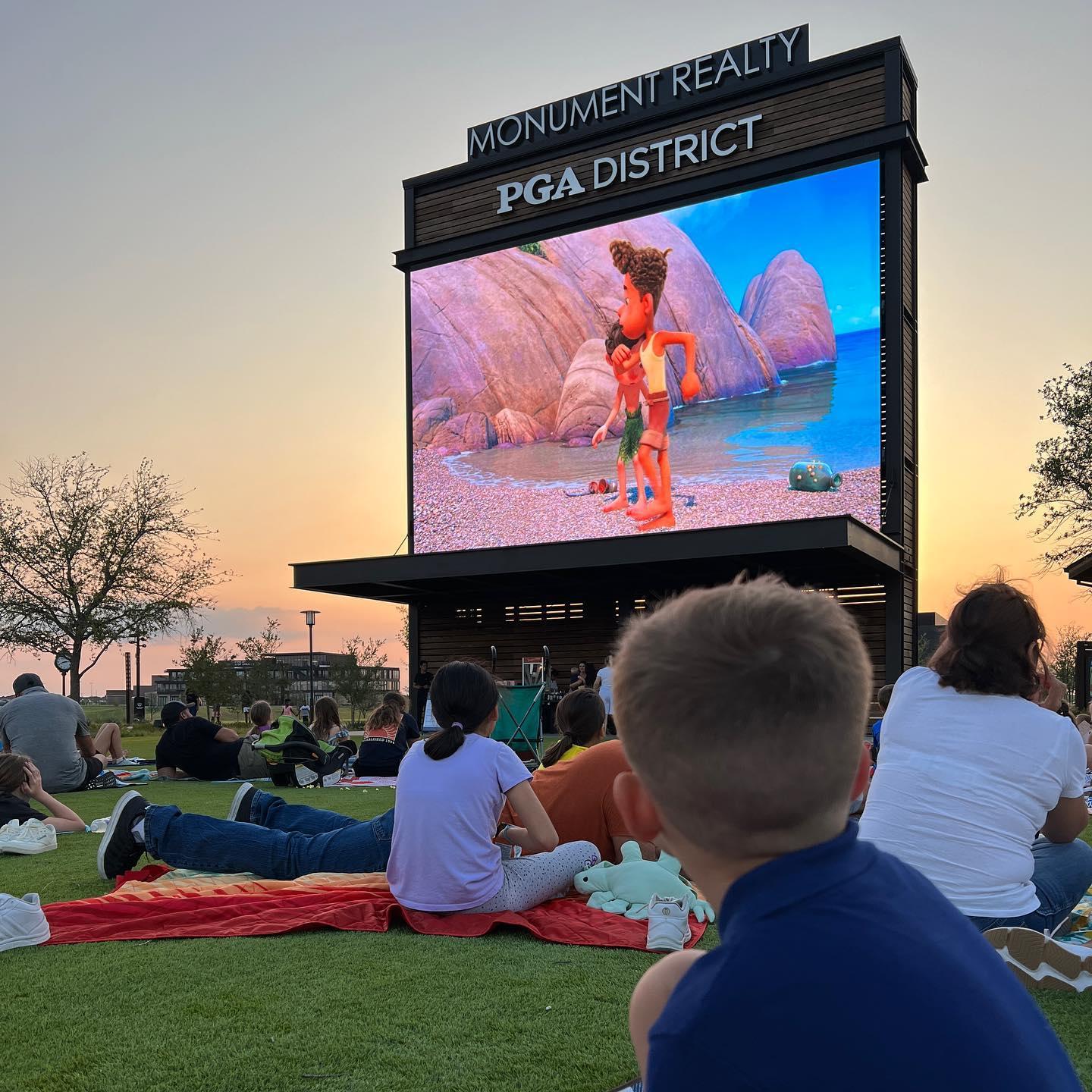 Families watching a movie ourdoors