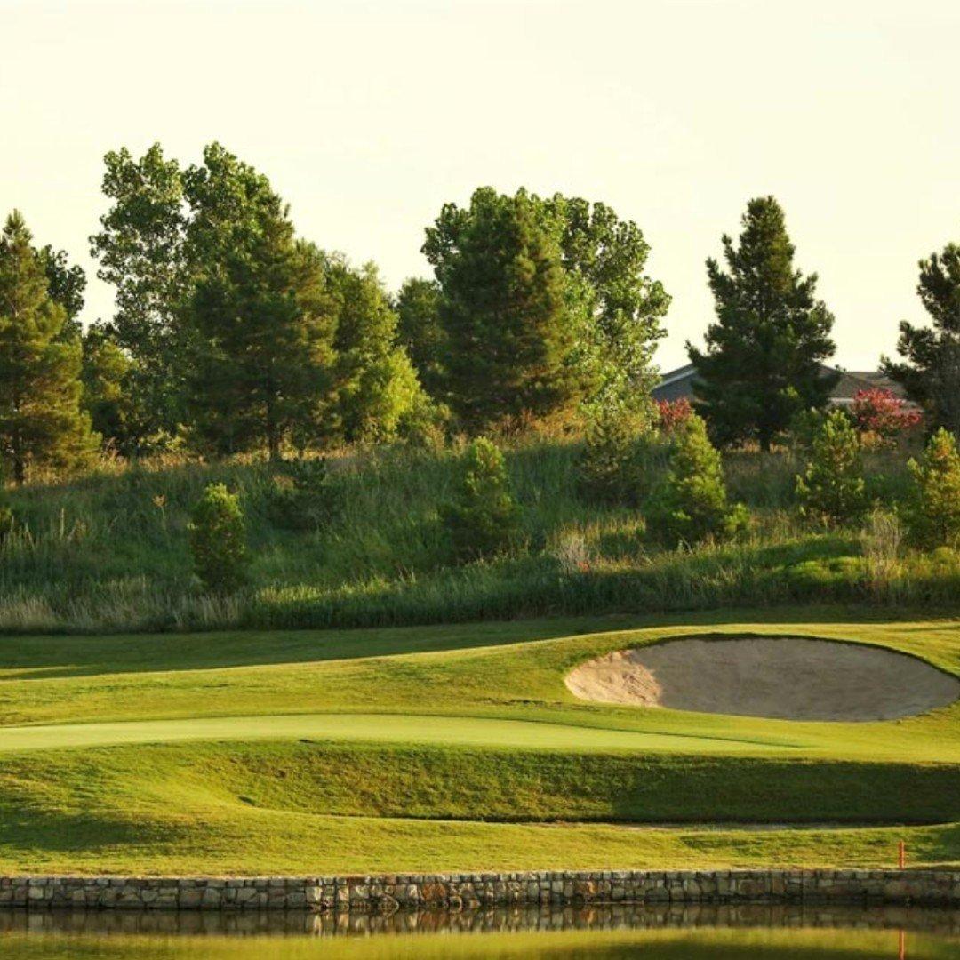 a small sandpit across a pond