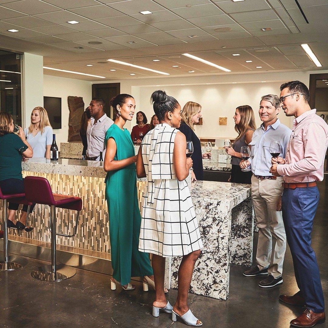 Groups of people chatting while having a drink at a conference