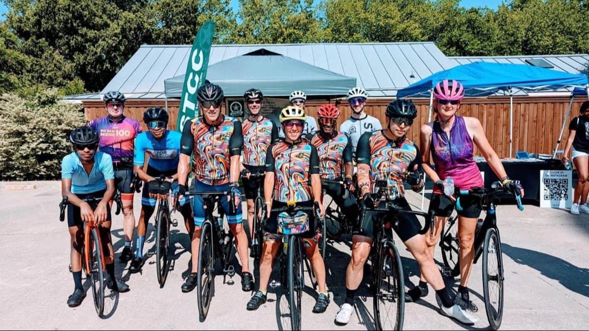 A group of people on bikes posing for a group photo