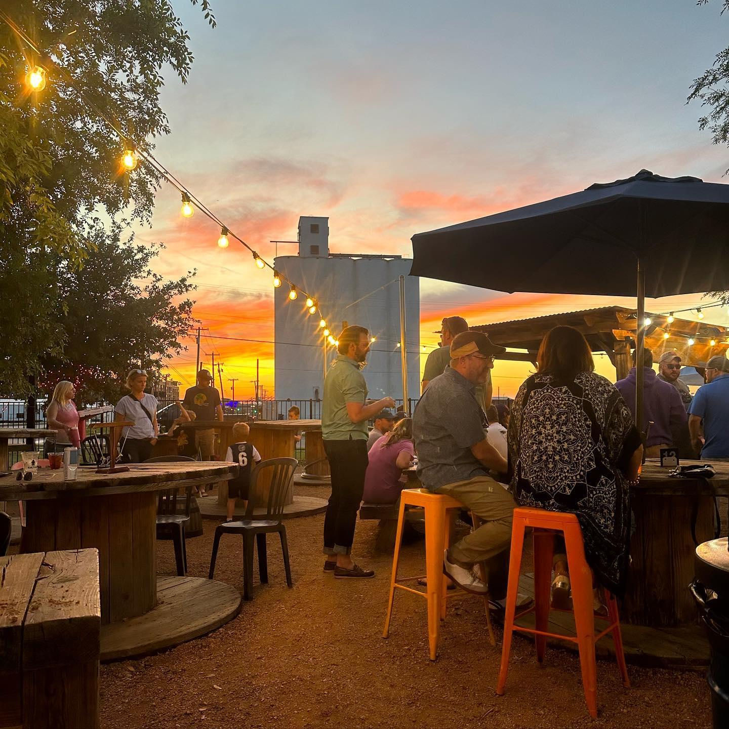 People on the Rail Yard patio drinking and having a good time